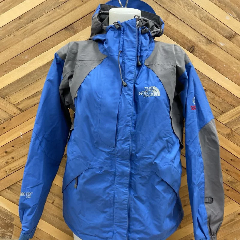 The North Face - Women's Summit Series Gore-Tex XCR Ski Jacket: Blue/Grey-women-MD Zippered Front Buttoned Front Snap Front The North Face - Women's Summit Series Gore-Tex XCR Ski Jacket: Blue/Grey-women-MD Zippered Front Buttoned Front Snap Front